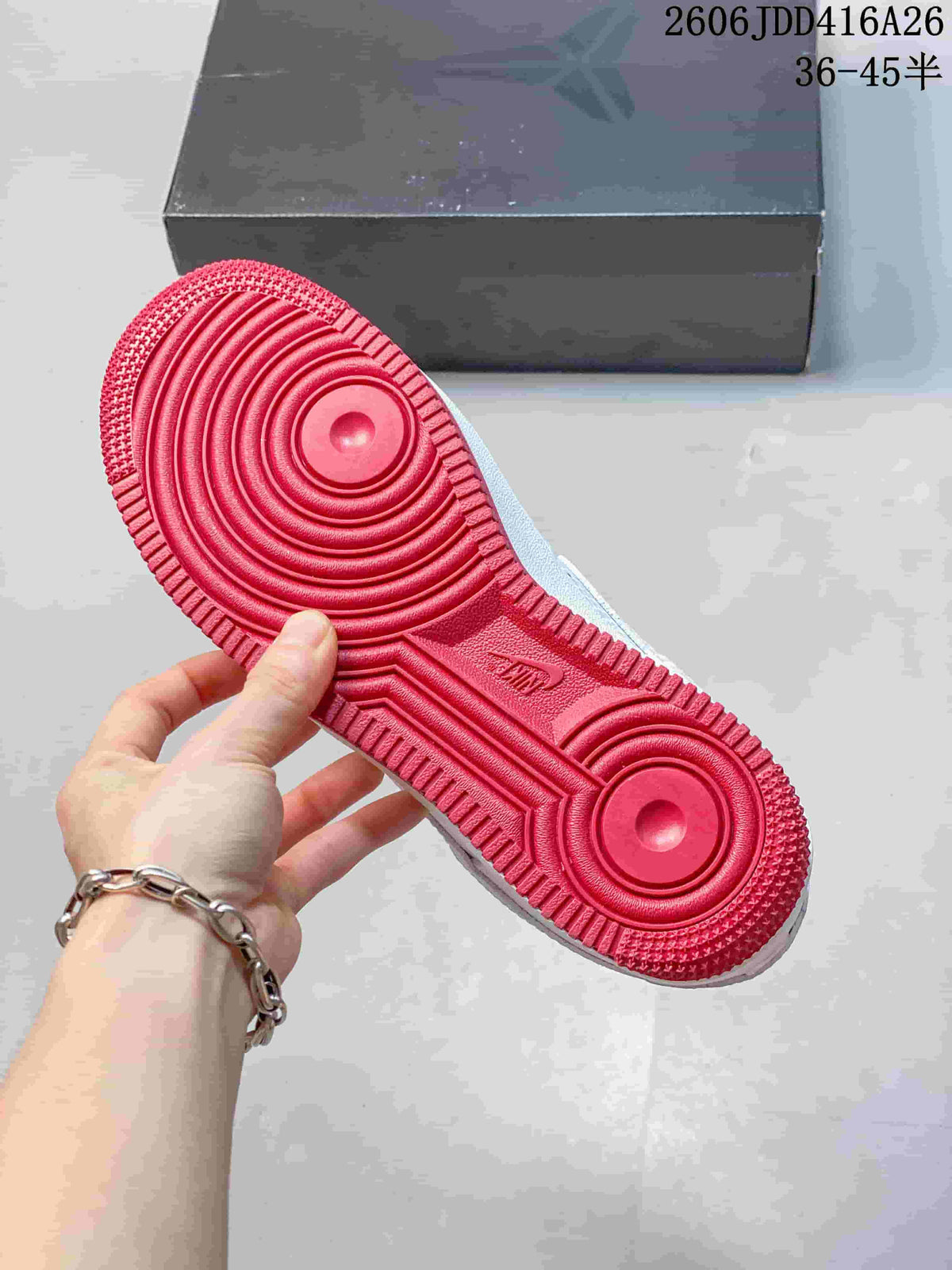 Close-up of the sneaker's red outsole with circular tread details.