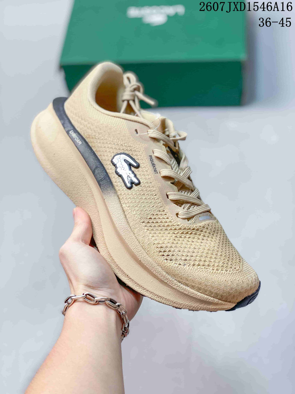 Beige Lacoste Neo Run low-top sneaker with matching laces, dark heel accent, crocodile side logo, and sculpted sole; size range text 36–45 is visible.