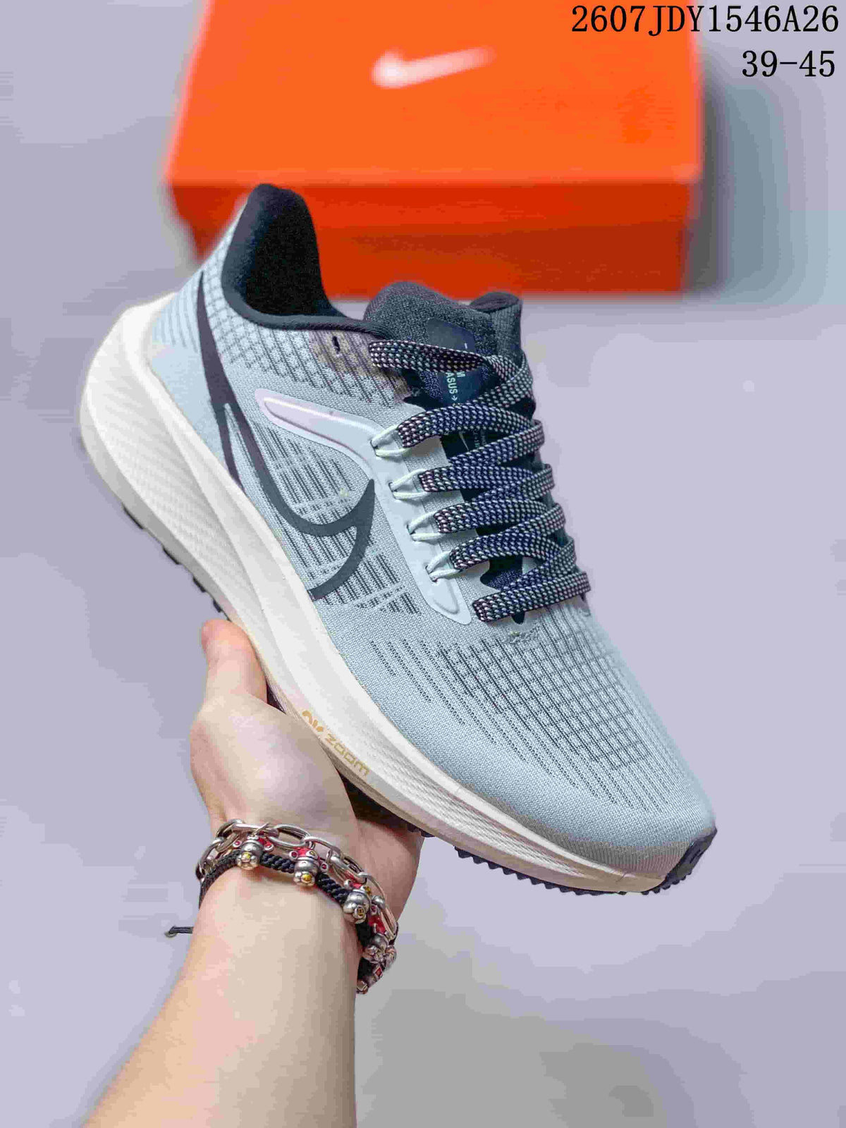 Light gray Nike Air Zoom Pegasus 39 sneaker with dark side branding and patterned dark laces.