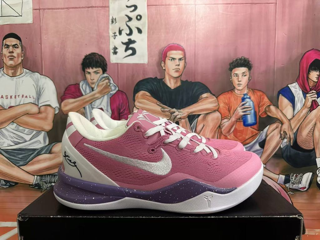 Side view showing pink upper, white side logo and heel panel, and purple-speckled midsole.
