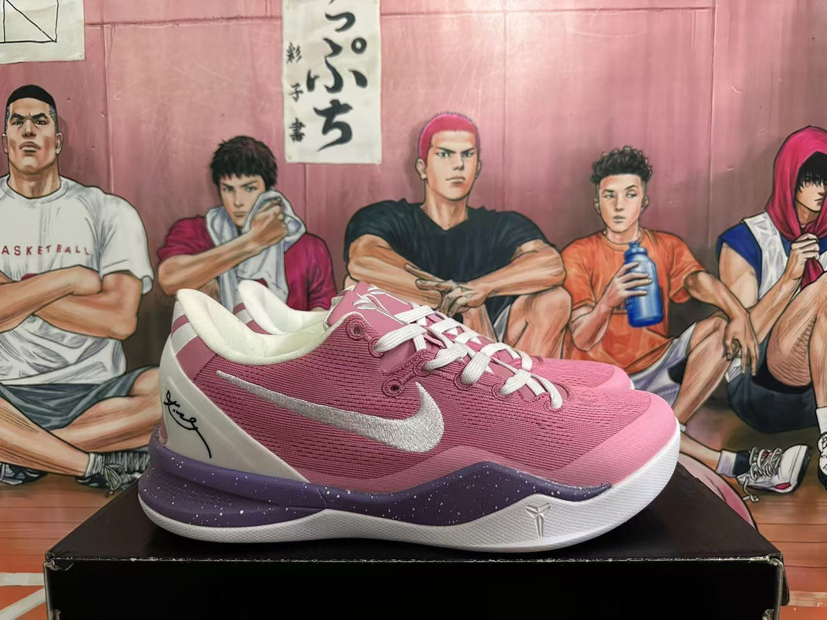 Side view showing pink upper, white side logo and heel panel, and purple-speckled midsole.