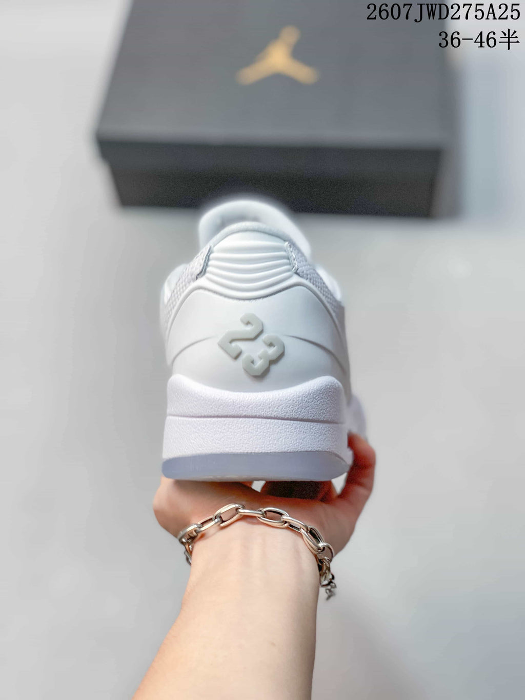 Rear view showing the padded heel, raised Jordan 23 detail and layered sole.