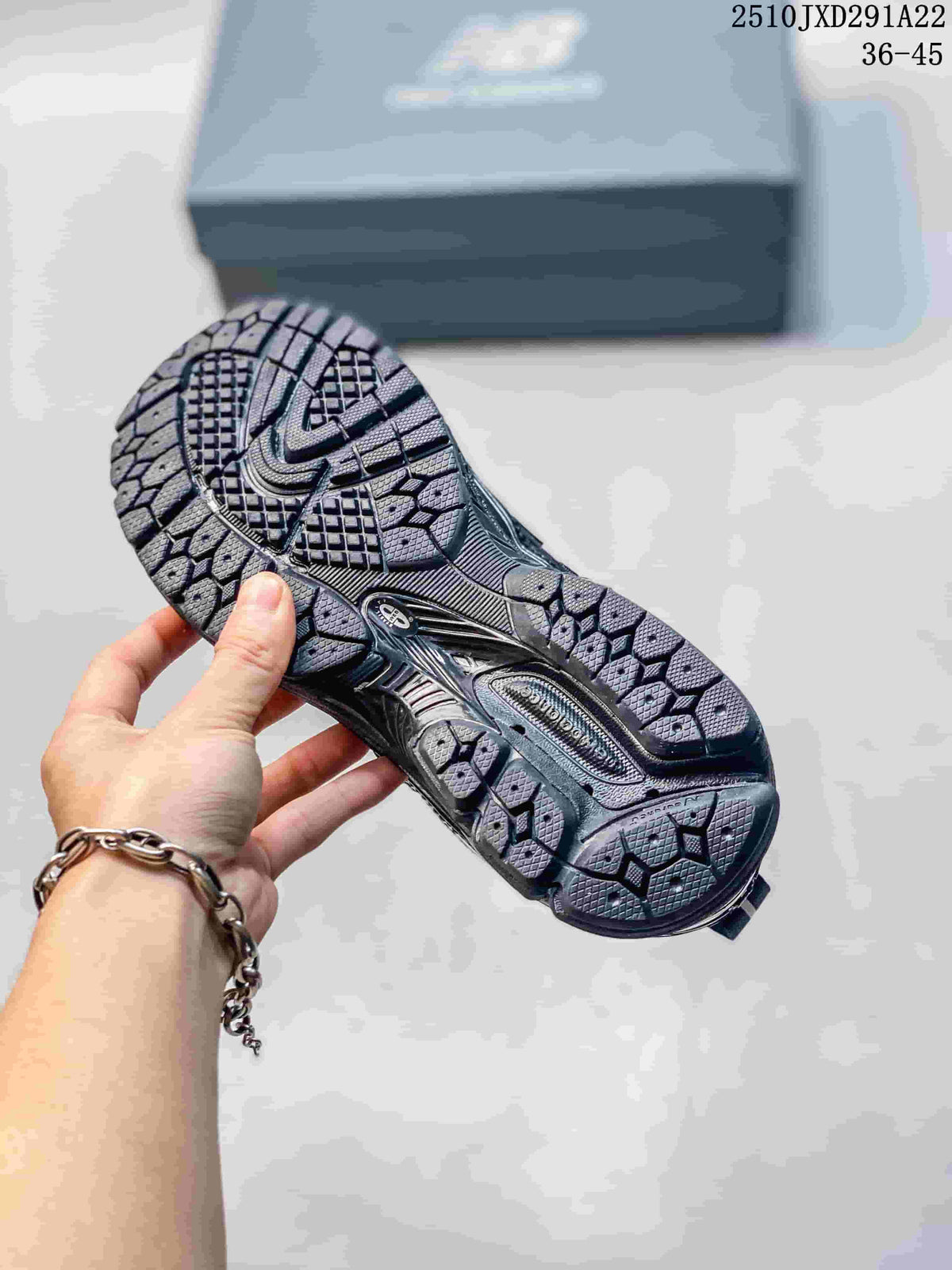 Outsole view of a gray and silver New Balance M1906AD sneaker