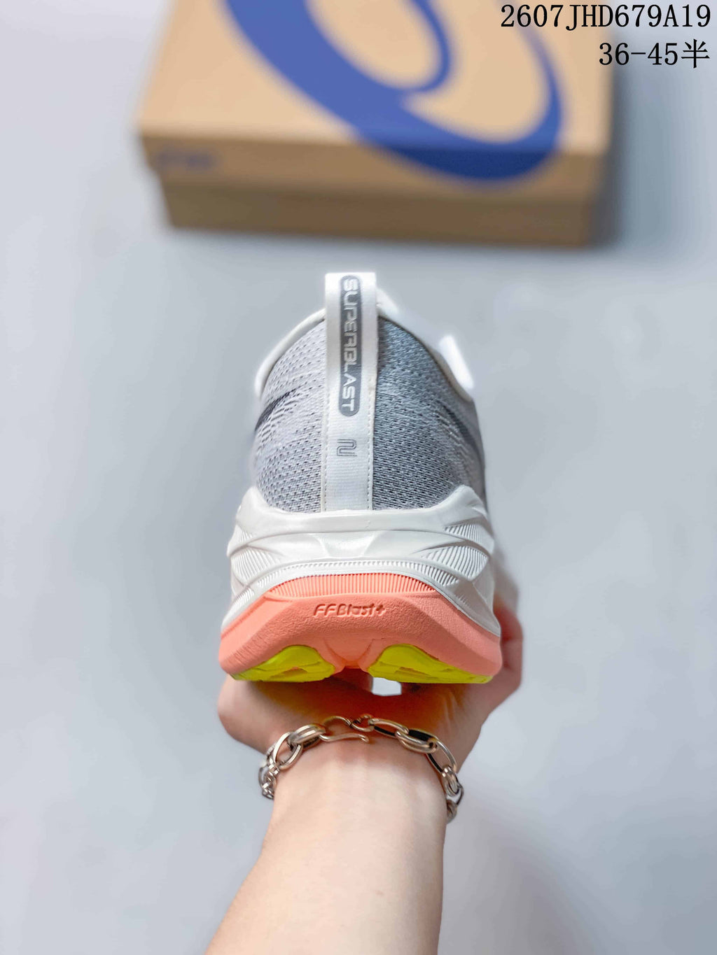 Rear view of an ASICS Superblast 2 shoe showing the SUPERBLAST heel label and layered outsole.