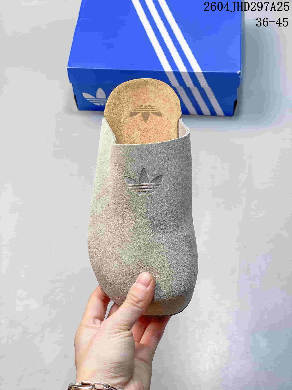 Top view of an adidas Adimule slipper showing its closed toe and Trefoil detail.