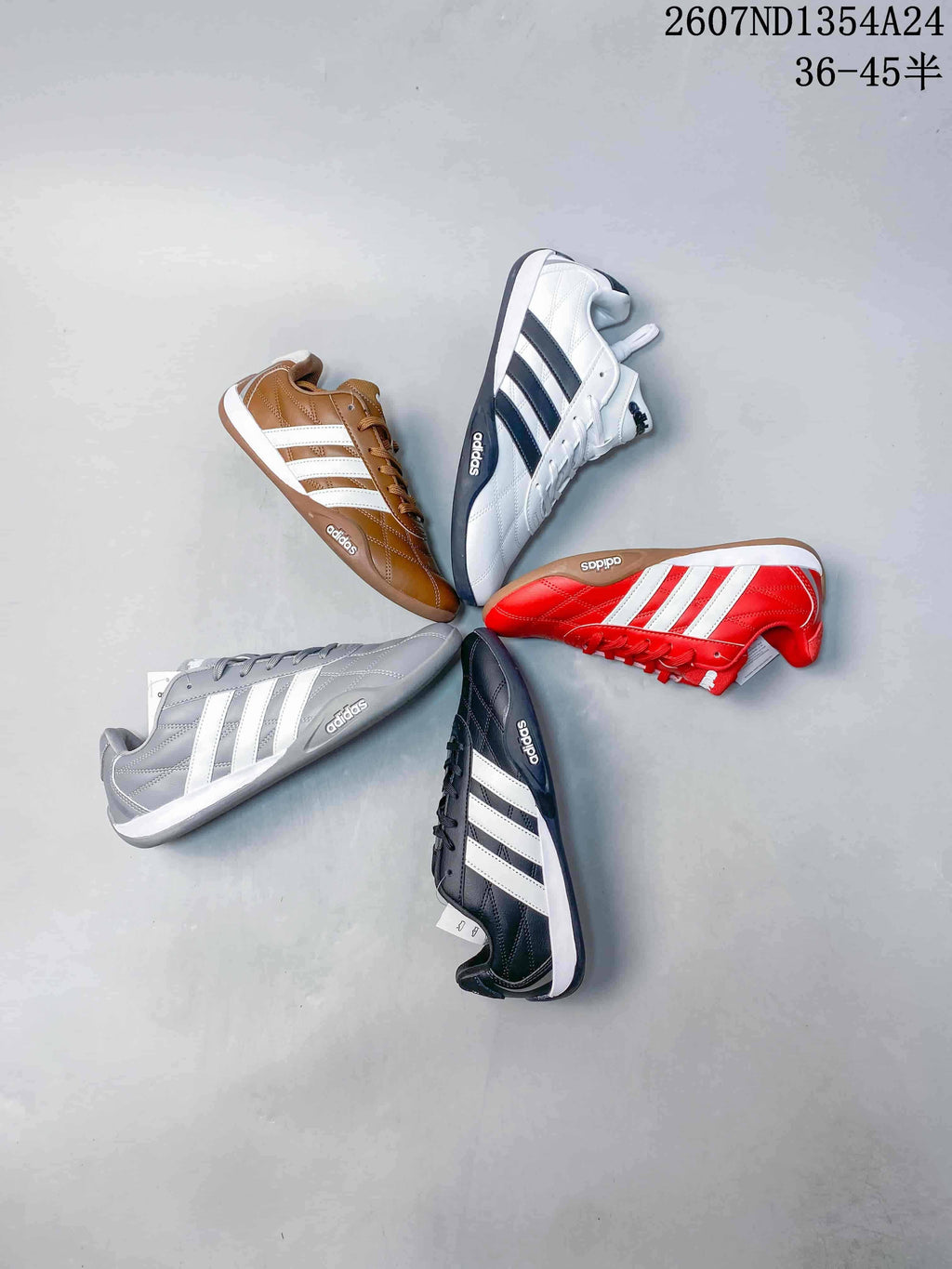 Five adidas Adipista sneakers arranged together in brown, white and black, red, gray, and black colorways.