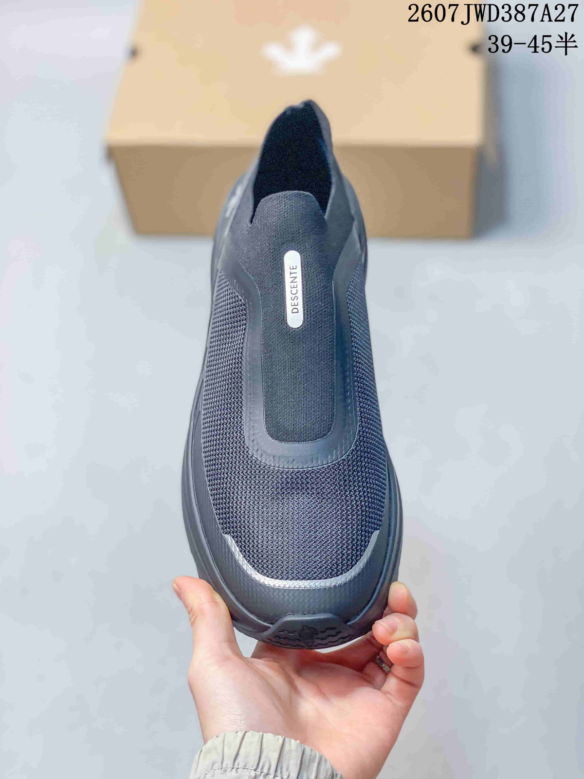 Top view showing the lace-free opening, textured toe area, and DESCENTE branding.