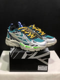 Pair of teal, white, black, and yellow Off-White Be Right Back sneakers displayed on a branded shoebox.