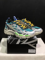 Pair of teal, white, black, and yellow Off-White Be Right Back sneakers displayed on a branded shoebox.