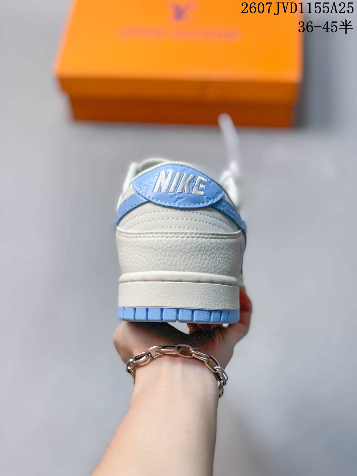 Rear view showing the white heel, blue outsole edge, and Nike-branded heel detail.