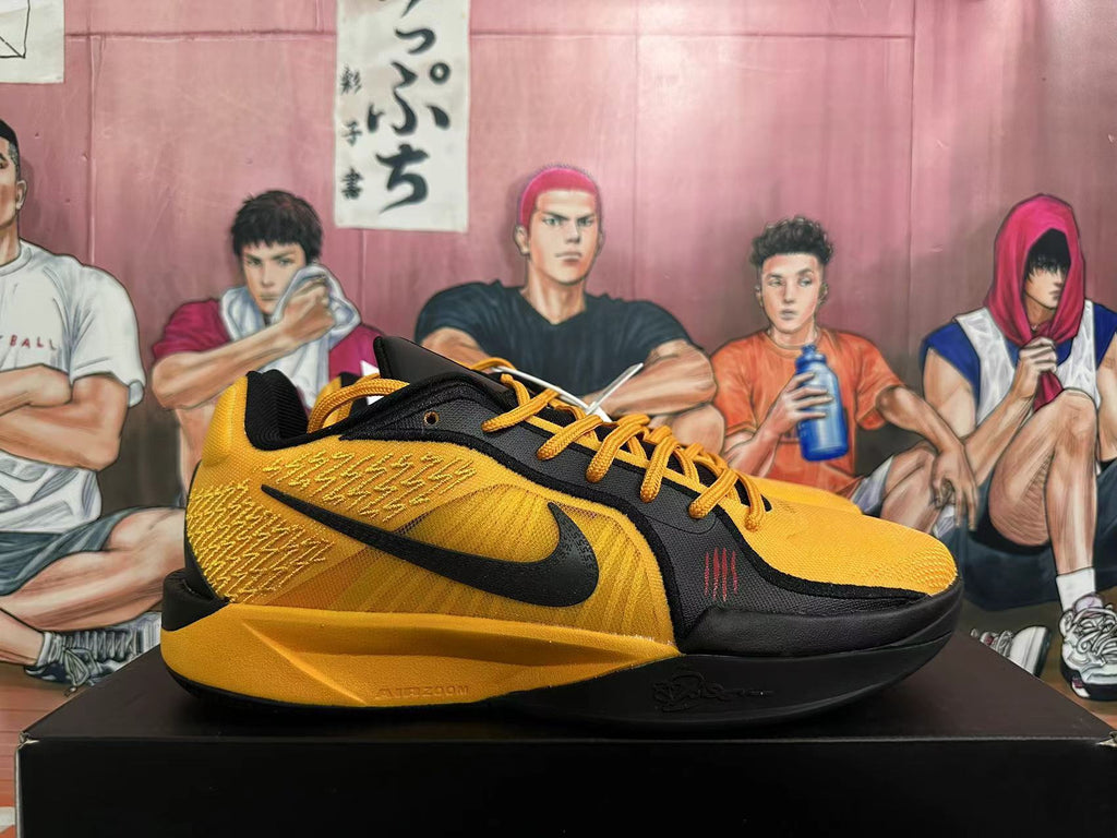 Side view showing the black Swoosh and textured yellow panels