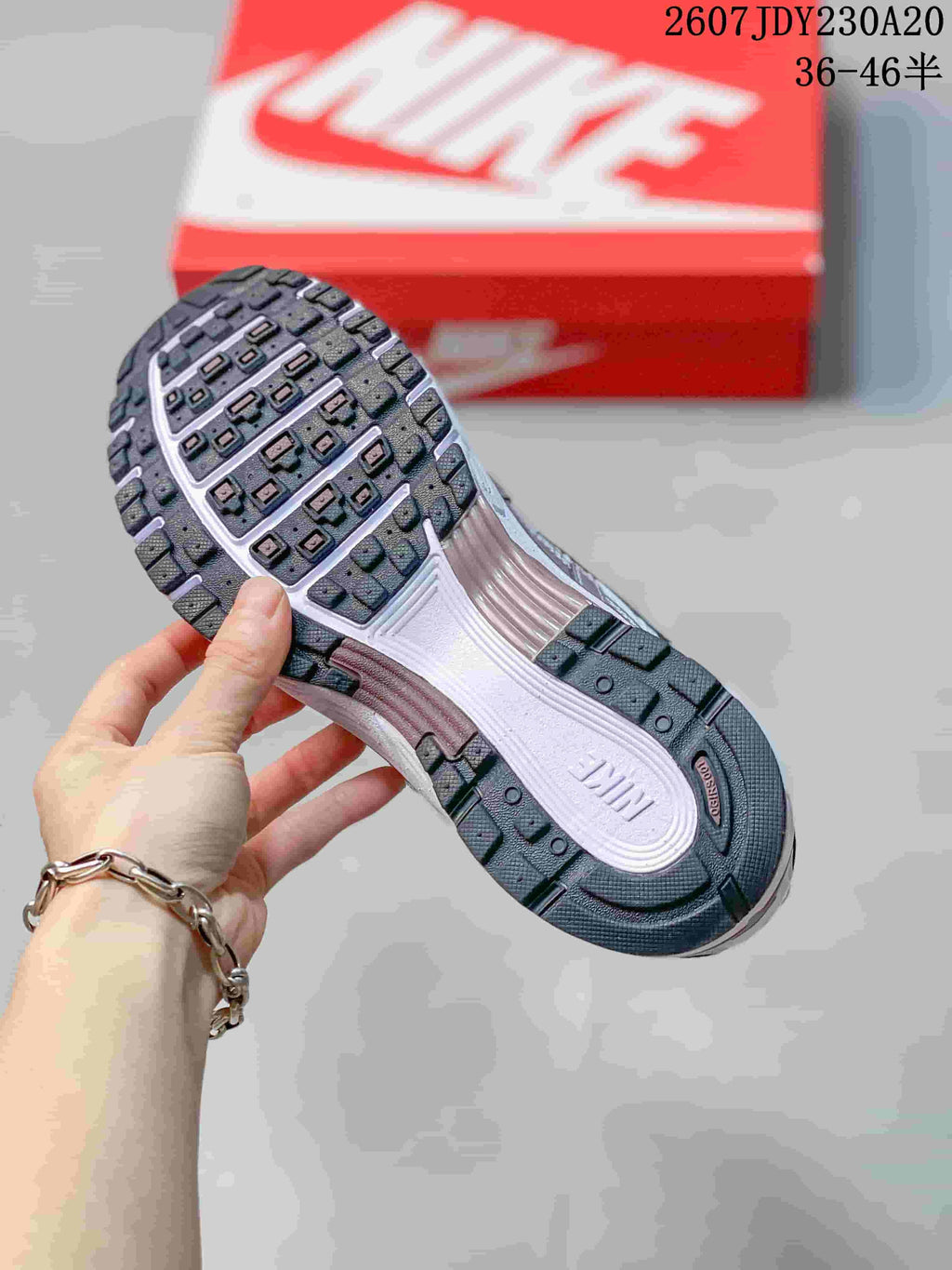 Close view of the textured rubber outsole and segmented tread pattern of the sneaker.