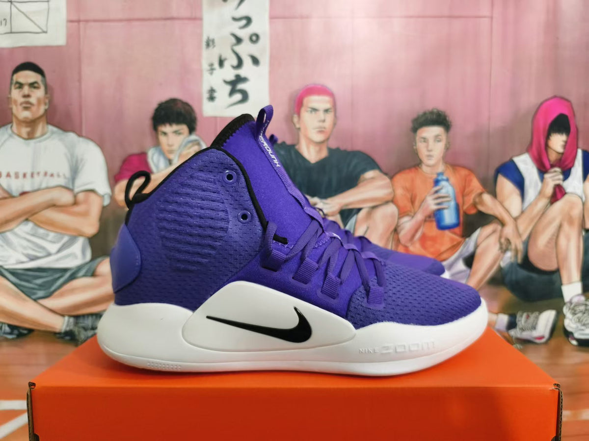 Side view of a purple Nike high-top basketball shoe with a black Swoosh and white sole