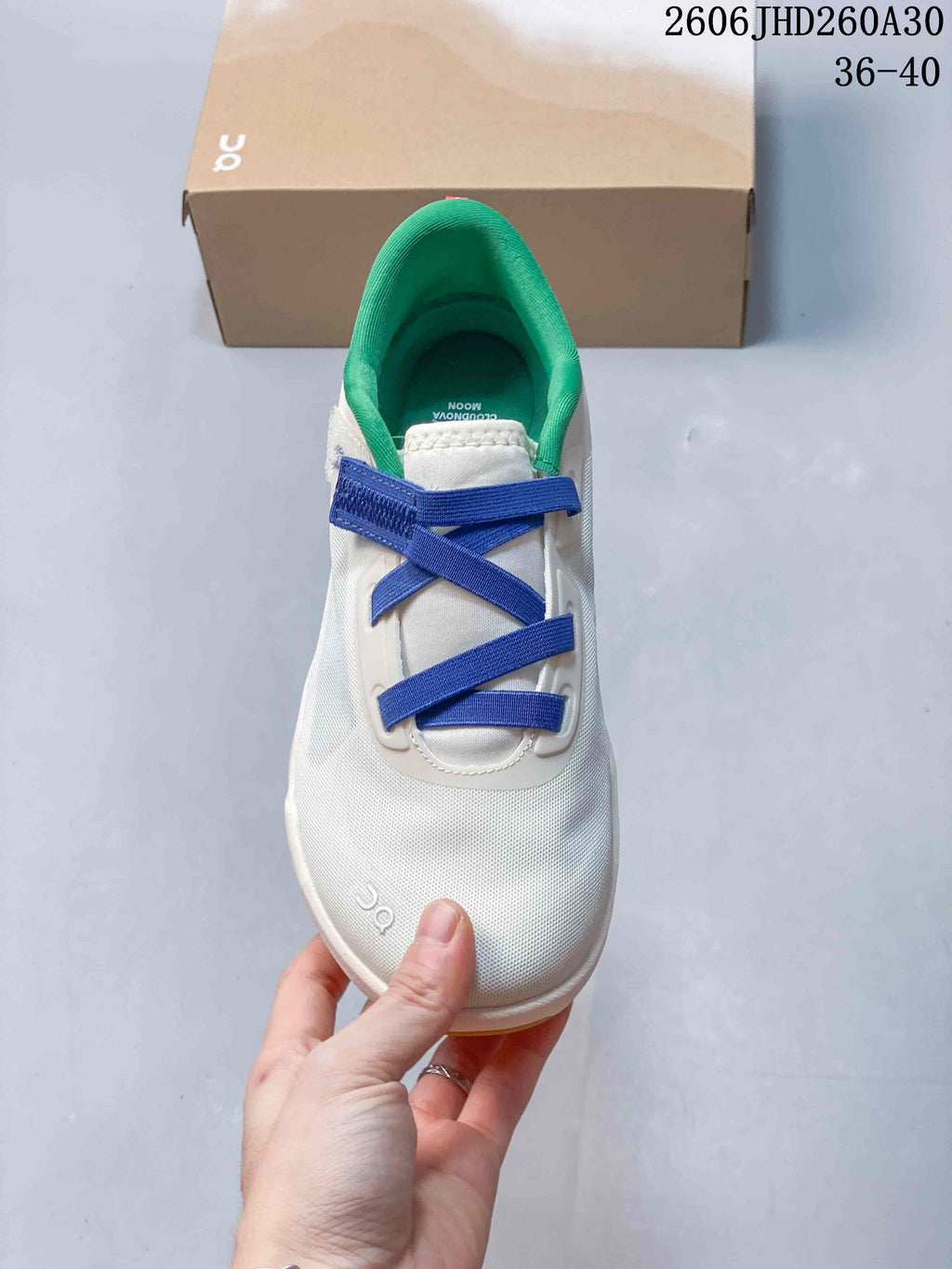 Top view of the sneaker showing blue lacing and green lining
