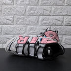 Top view of sneaker showing mesh tongue, black laces, and wide grey lace loops