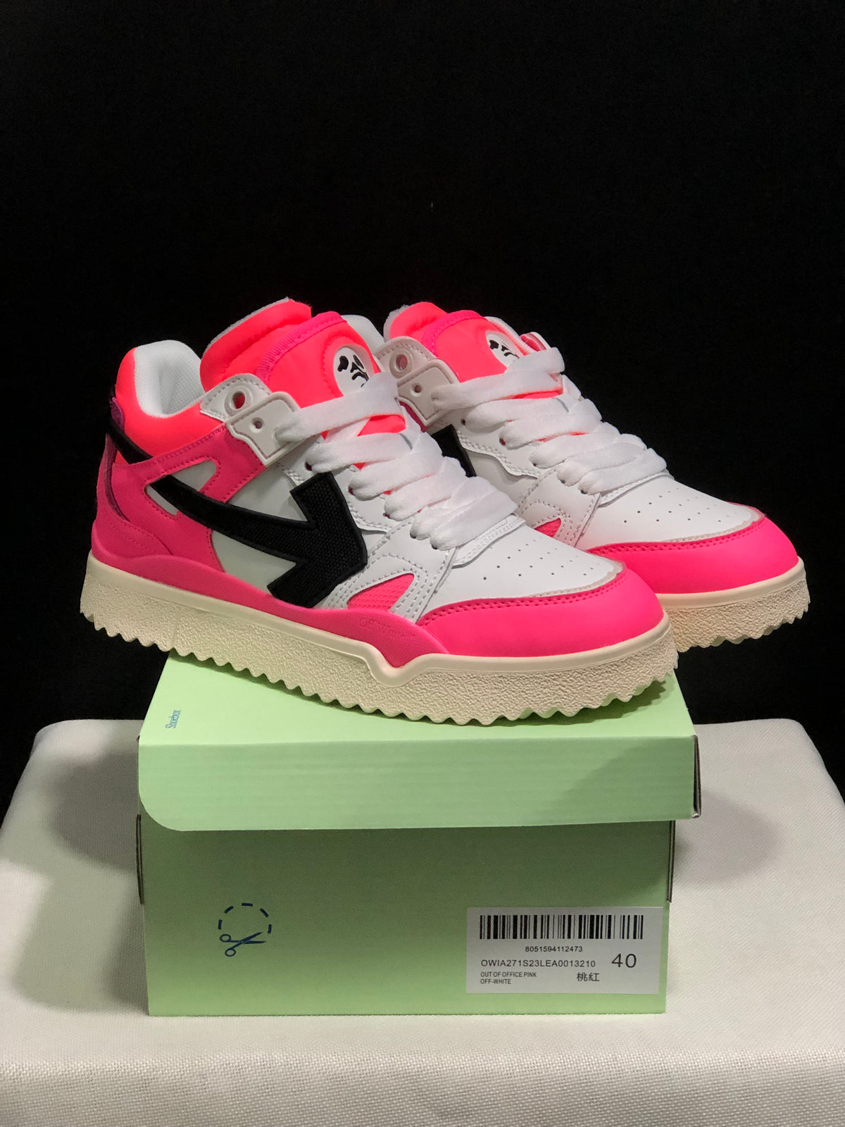 Pair of pink, white, and black Off-White sneakers displayed on a shoebox; the box label shows size EU 40 and identifies the color as Out Of Office Pink.