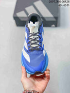 Top view of the sneaker showing the blue mesh-like upper, black-and-white laces, white tongue and adidas branding.