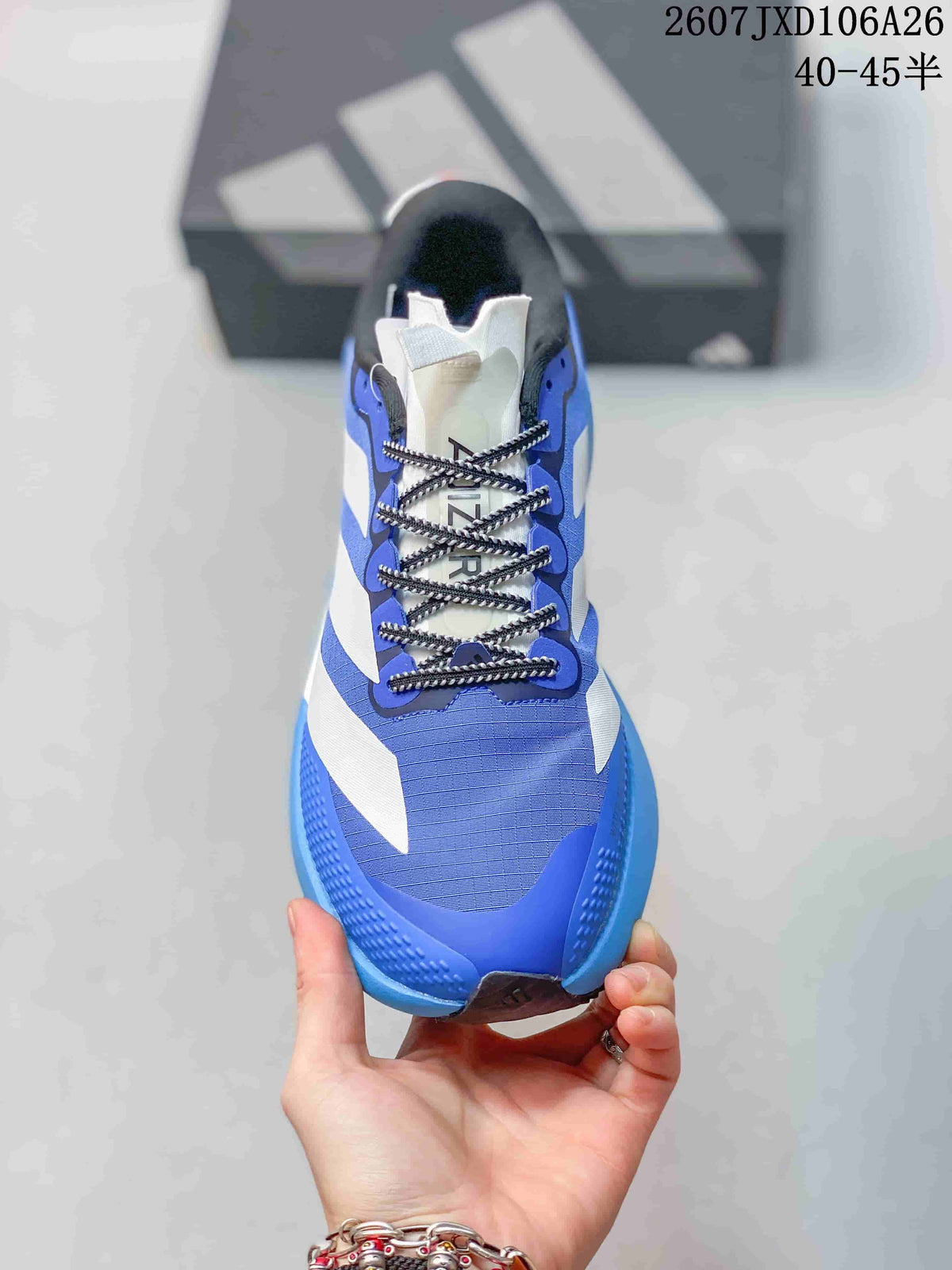 Top view of the sneaker showing the blue mesh-like upper, black-and-white laces, white tongue and adidas branding.