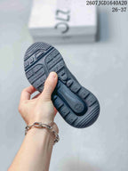 Close view of the black textured outsole with molded traction sections and Air Max branding.