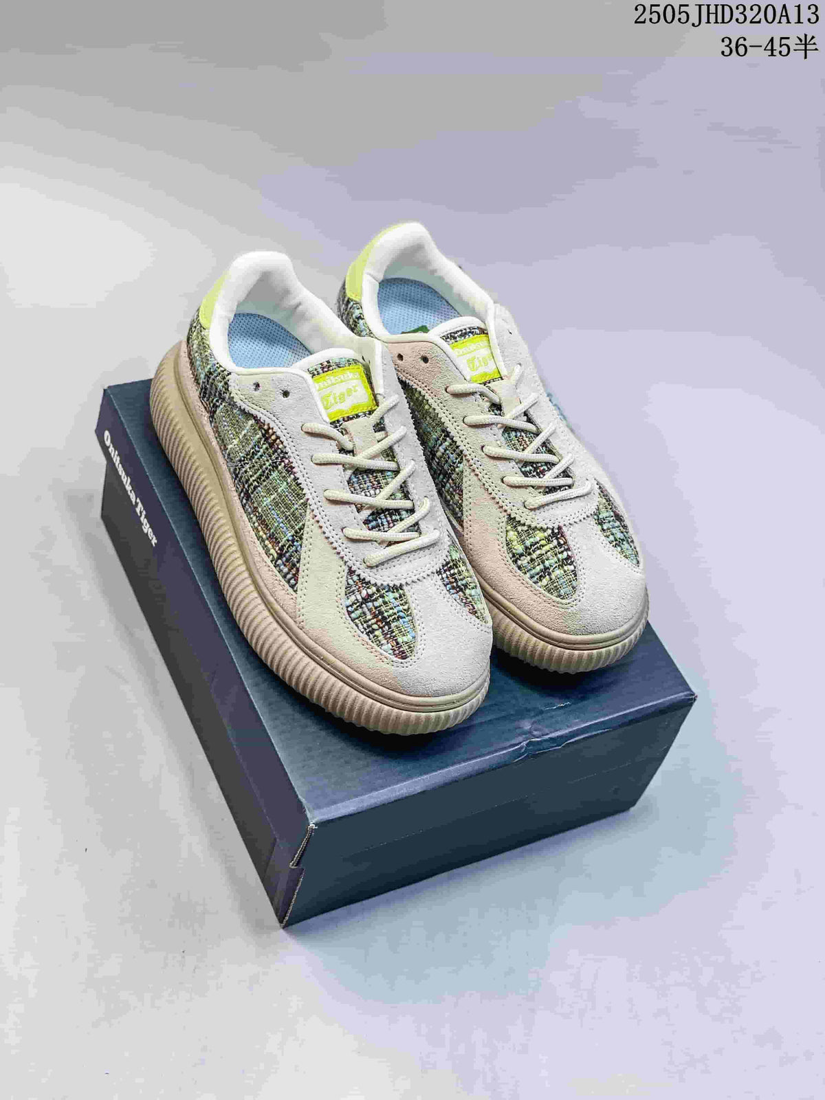 Pair of multicolor Onitsuka Tiger Delecity low-top sneakers displayed on a shoebox