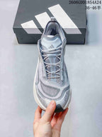 Front view of an Adidas Holo Peak shoe showing its laces, tongue, and patterned upper
