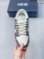 Top view of the sneaker showing white laces, perforated white toe box, patterned overlays, and Dior branding on the tongue.