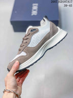 Side profile of the sneaker showing the patterned side panel, taupe overlays, lace-up construction, and layered sole.
