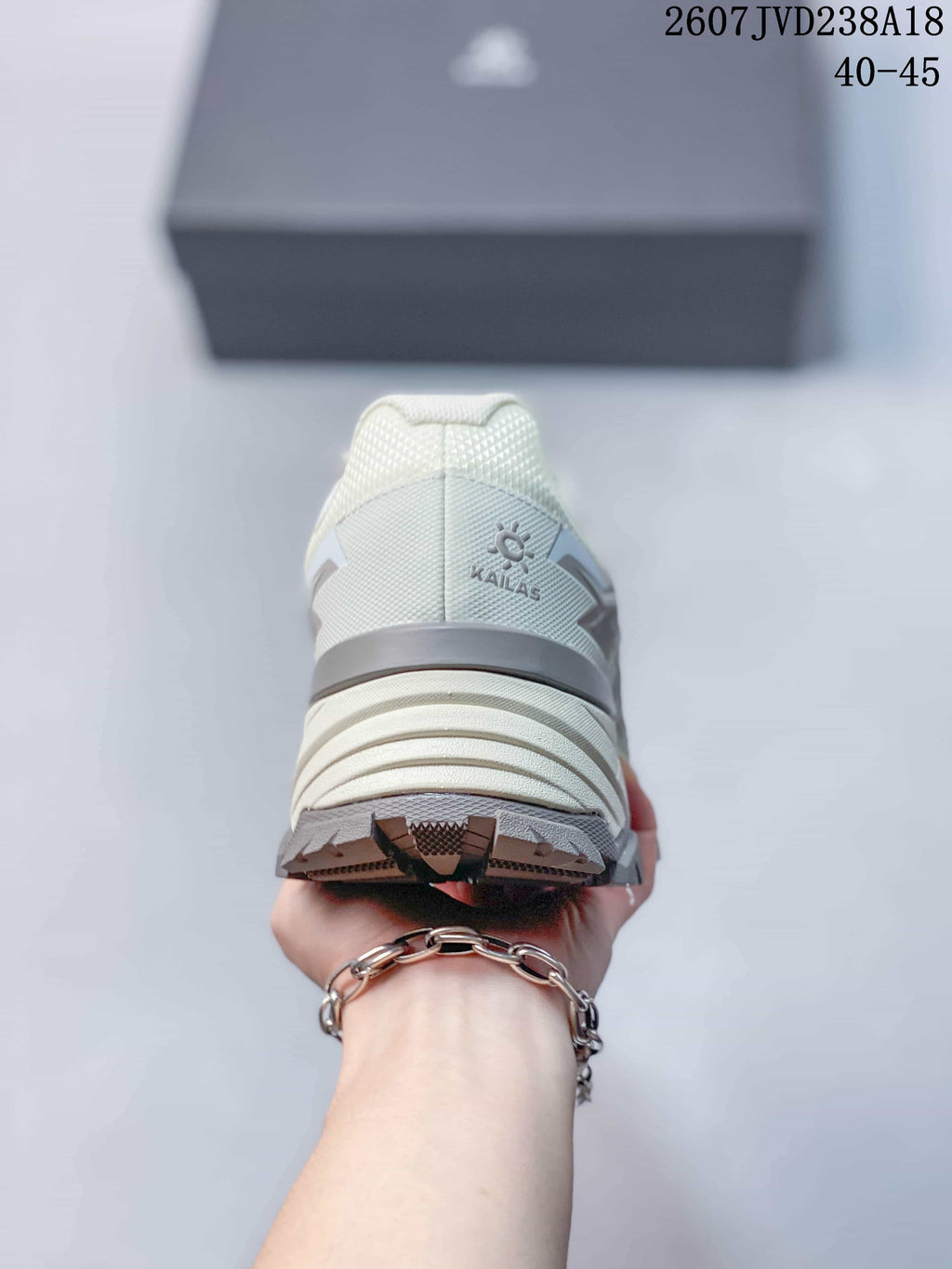 Rear view of the KAILAS hiking shoe showing the padded heel collar, heel branding, layered midsole, and lugged outsole.