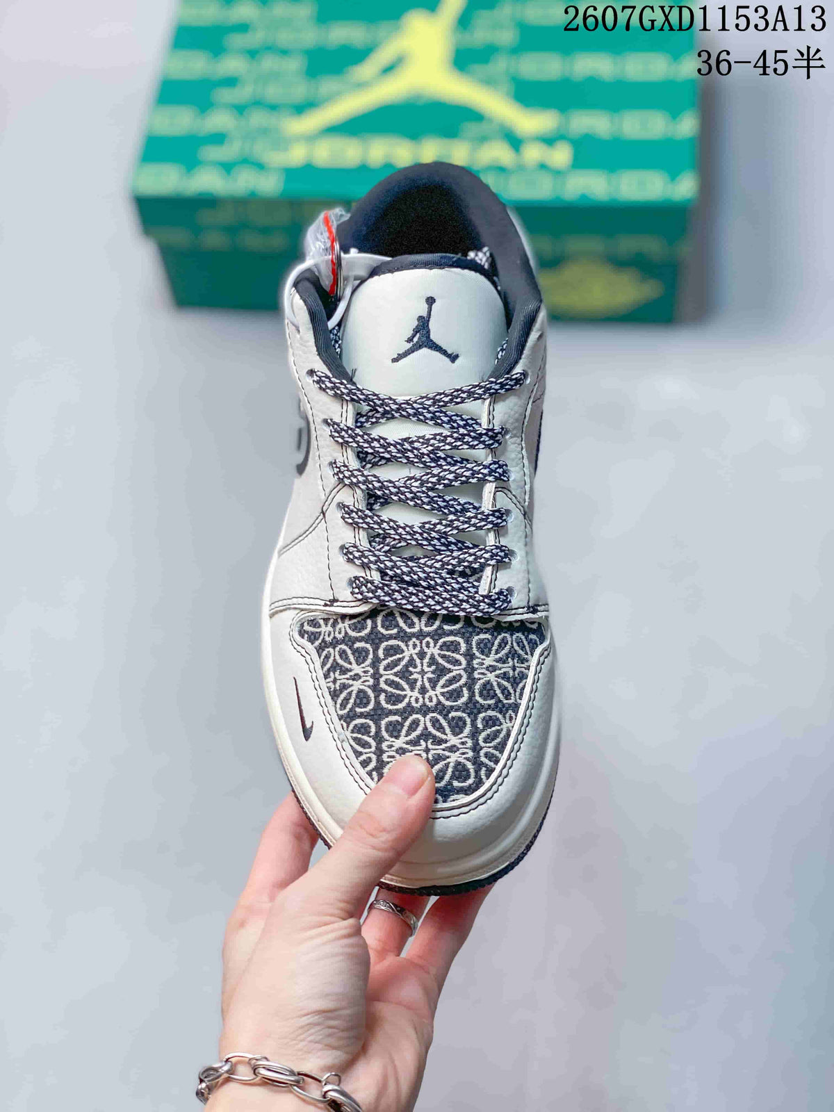 Top view showing patterned toe box, navy-and-white laces, white tongue, and dark tongue branding.