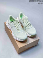 Pair of pale mint green and white On Cloudpulse 2 sneakers displayed on a cardboard shoebox; the image shows the lace-up design and visible size range text.