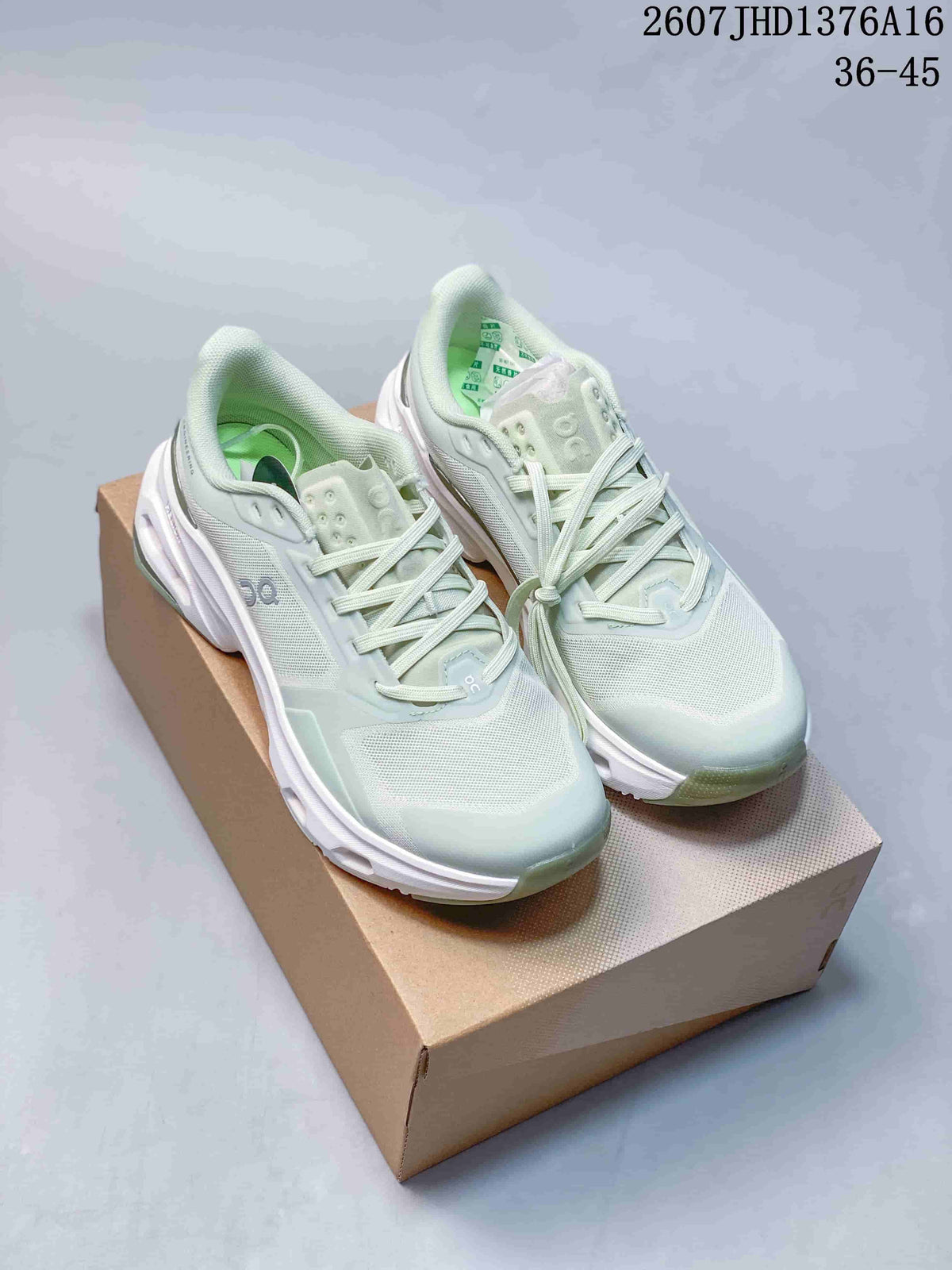 Pair of pale mint green and white On Cloudpulse 2 sneakers displayed on a cardboard shoebox; the image shows the lace-up design and visible size range text.