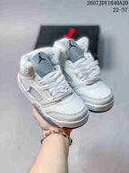 Pair of white kids' Jordan Air Jordan 5 Retro sneakers shown from a front three-quarter angle, with light-blue translucent outsoles.