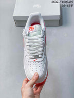 Top view of a white Nike Air Force 1 ’07 sneaker showing its laces and perforated toe.