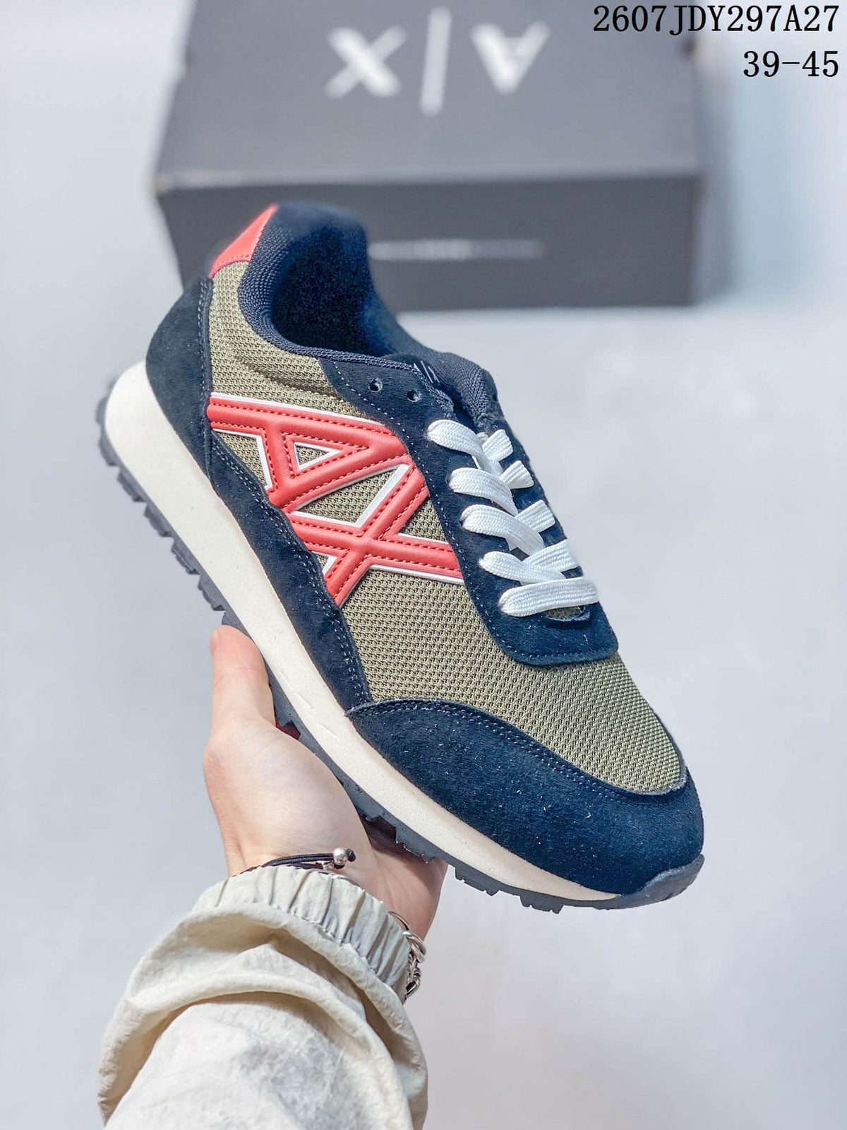 Navy, olive, and coral color-block low-top sneaker with white laces.