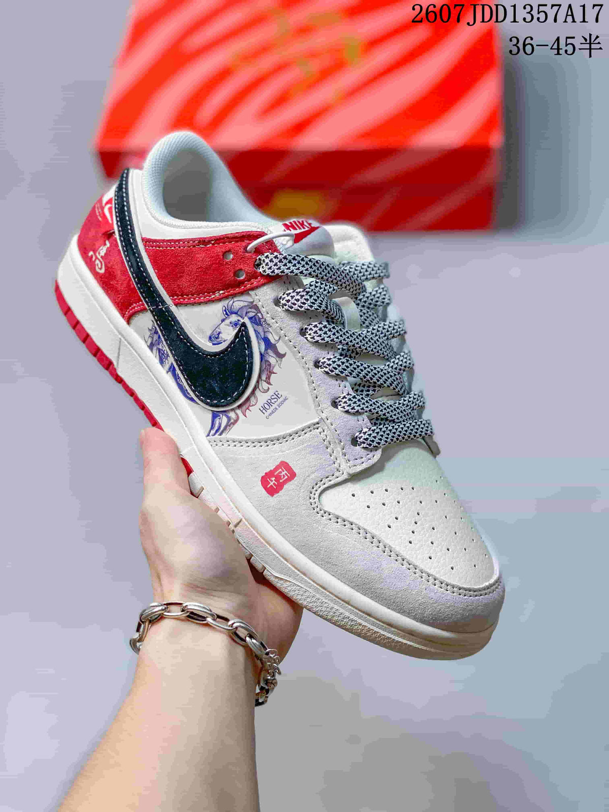 White and grey low-top sneaker with red and dark navy panels, horse artwork and patterned laces.