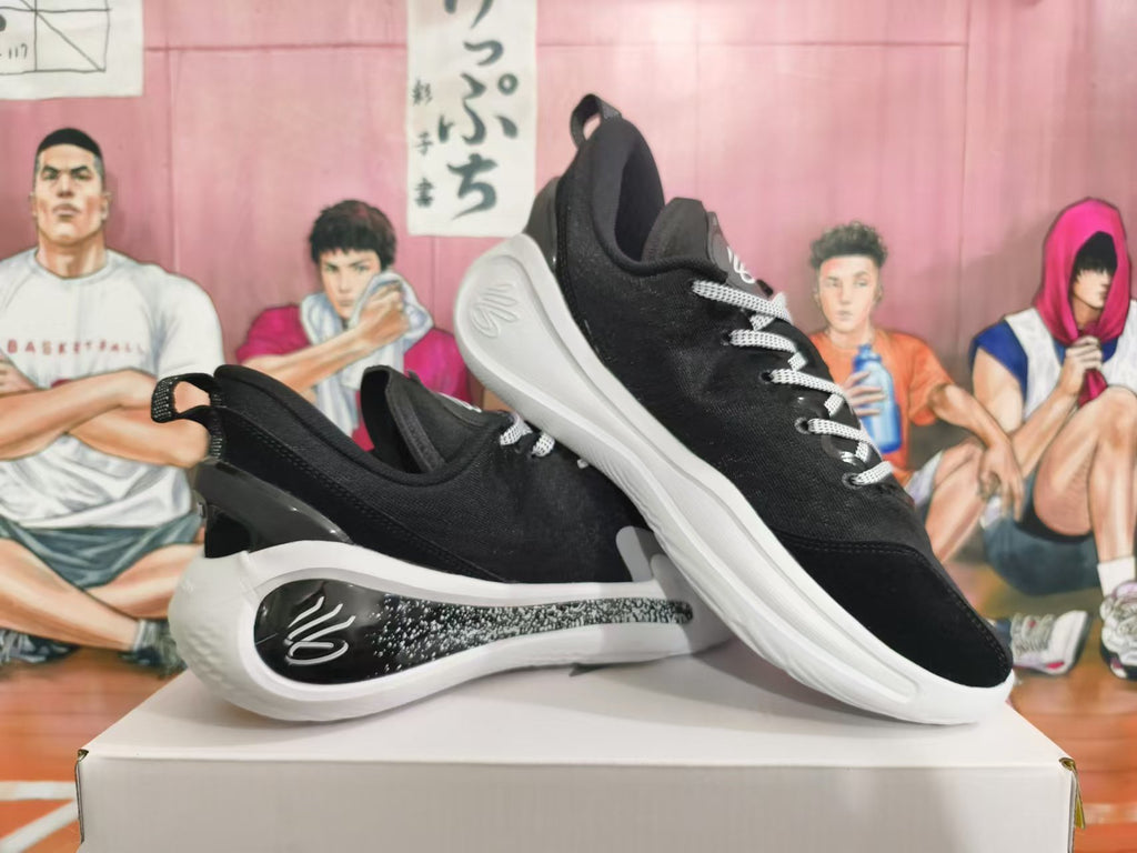 Two black basketball sneakers with white soles shown from side and three-quarter angles.