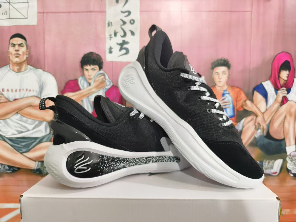 Two black basketball sneakers with white soles shown from side and three-quarter angles.