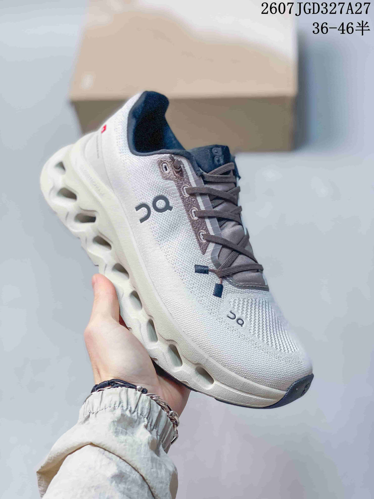 Angled side view of the On sneaker showing the white upper, dark laces, On logo, and sculpted sole.