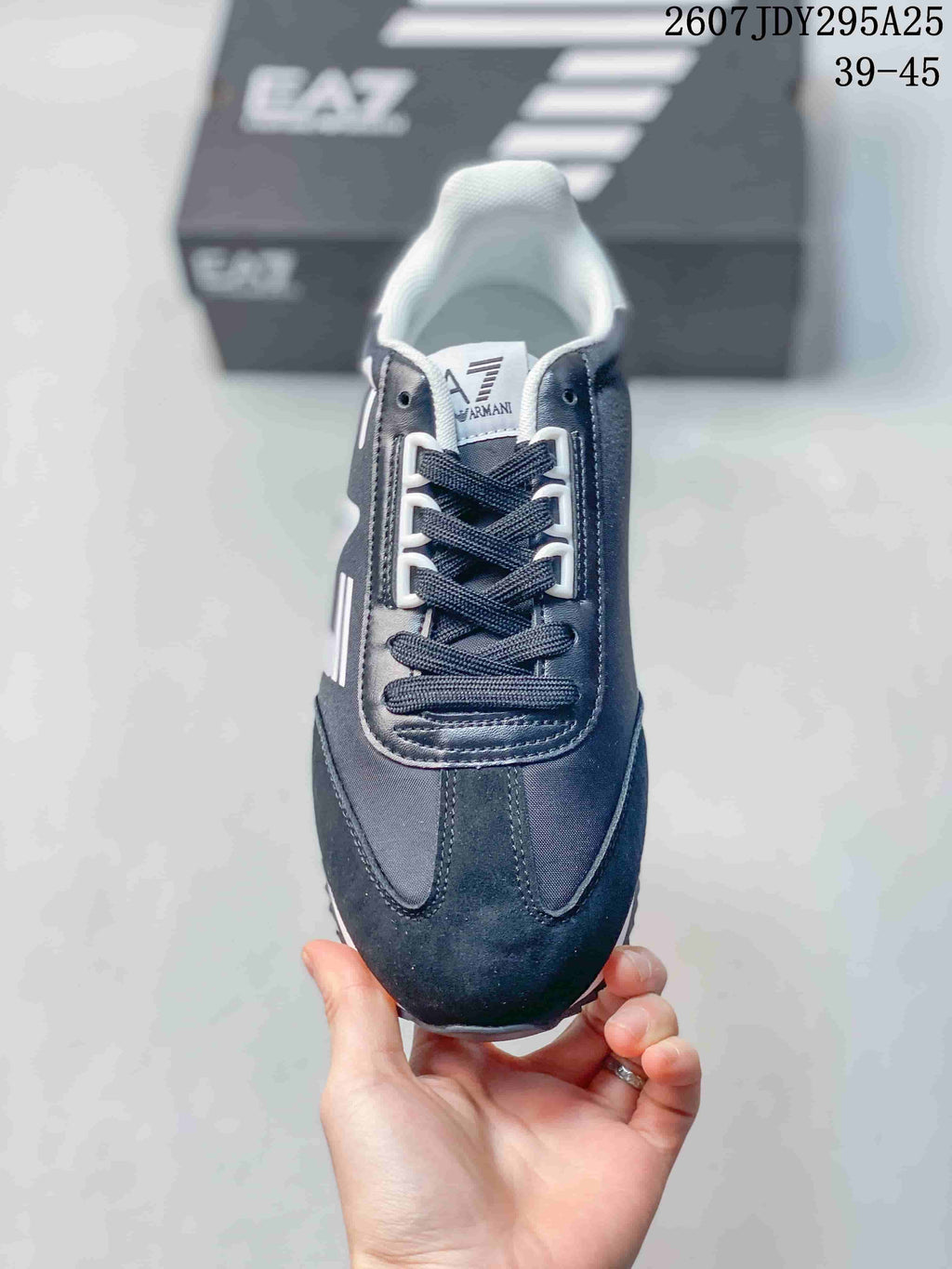 Top view of the sneaker showing dark laces, contrasting eyelets, padded tongue, and rounded toe.