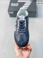 Top view of the sneaker showing dark laces, contrasting eyelets, padded tongue, and rounded toe.