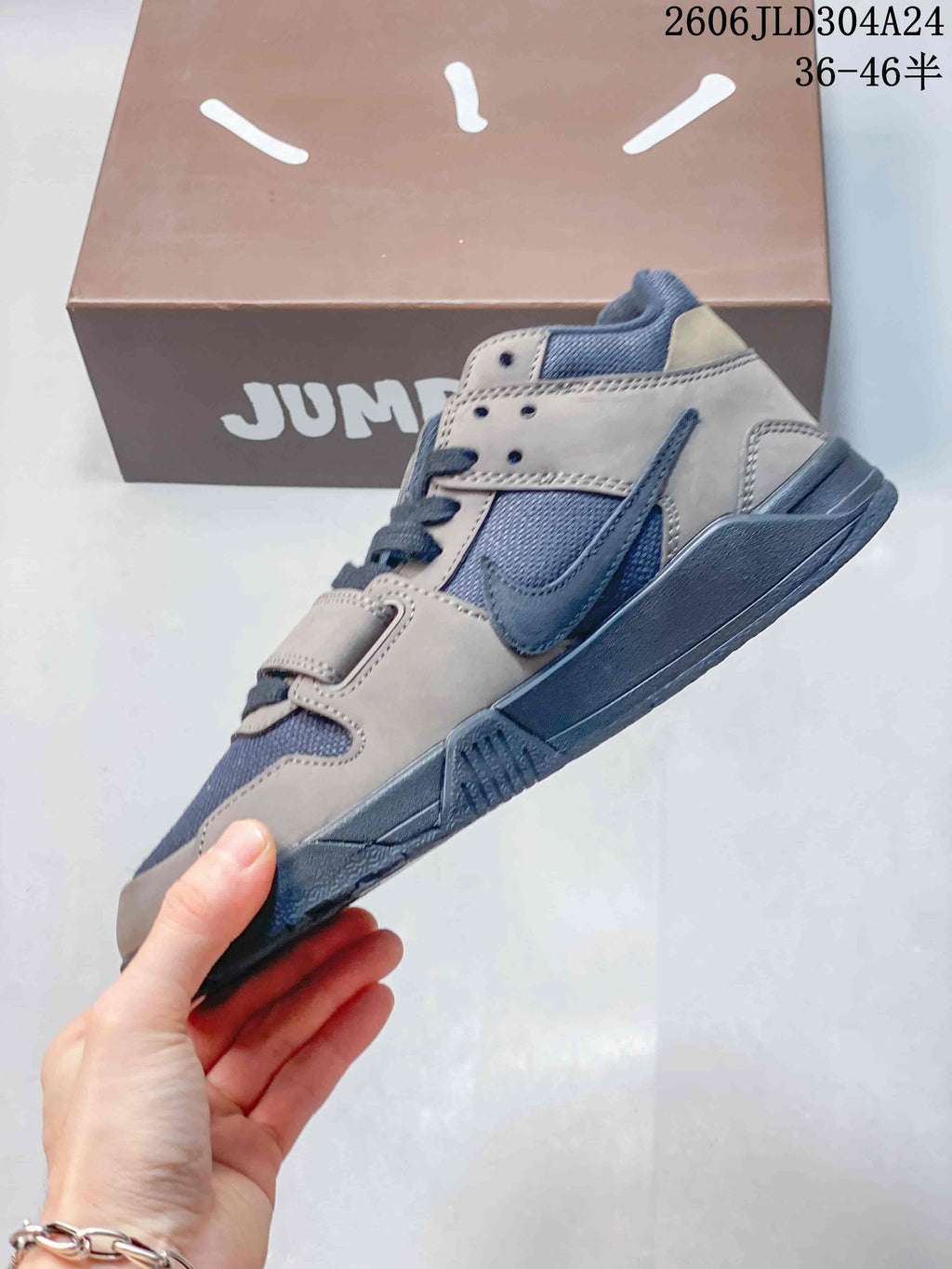 Side view showing the strap, laces, and dark blue-gray outsole