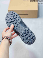 Close view of the textured outsole showing a pronounced lug pattern and ECCO branding.