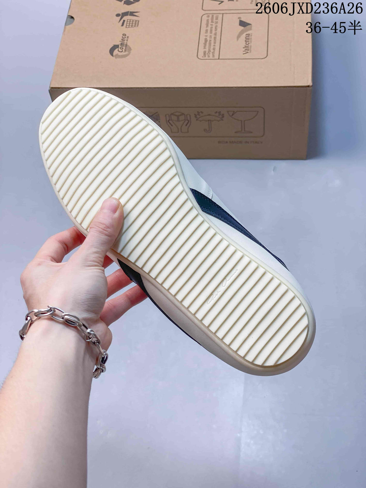 Close-up of the sneaker's light-colored ridged outsole.