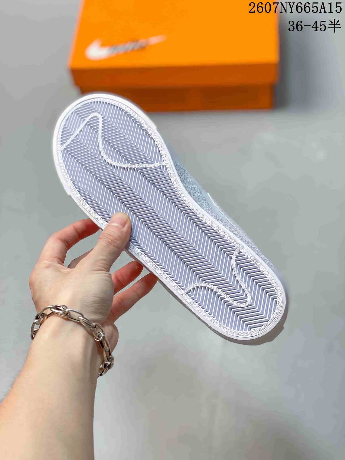 Underside view of the sneaker showing the white textured outsole with herringbone-style tread.
