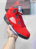 Angled side view of the red and black high-top sneaker with a translucent outsole.
