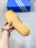 Bottom view of the sneaker showing the translucent gum outsole and circular patterned tread.