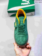 Top view showing the green laces, yellow collar, and Palermo tongue branding.