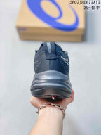 Rear view of a black ASICS running shoe showing the padded heel collar and layered sole.