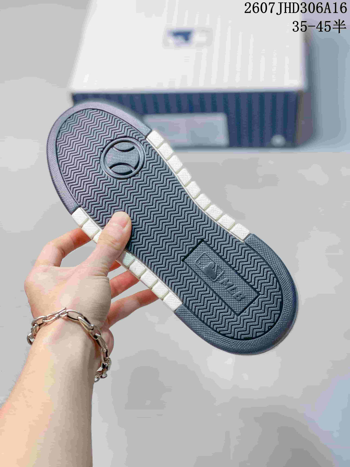 Underside view of the sneaker showing the navy herringbone outsole tread and MLB branding.