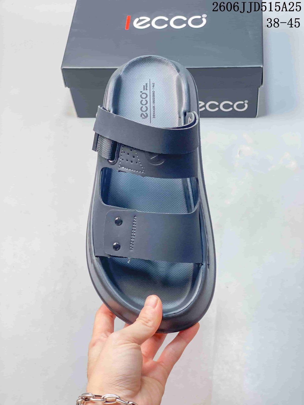 Top view of a dark gray sandal showing the open toe, two broad straps, and textured footbed.
